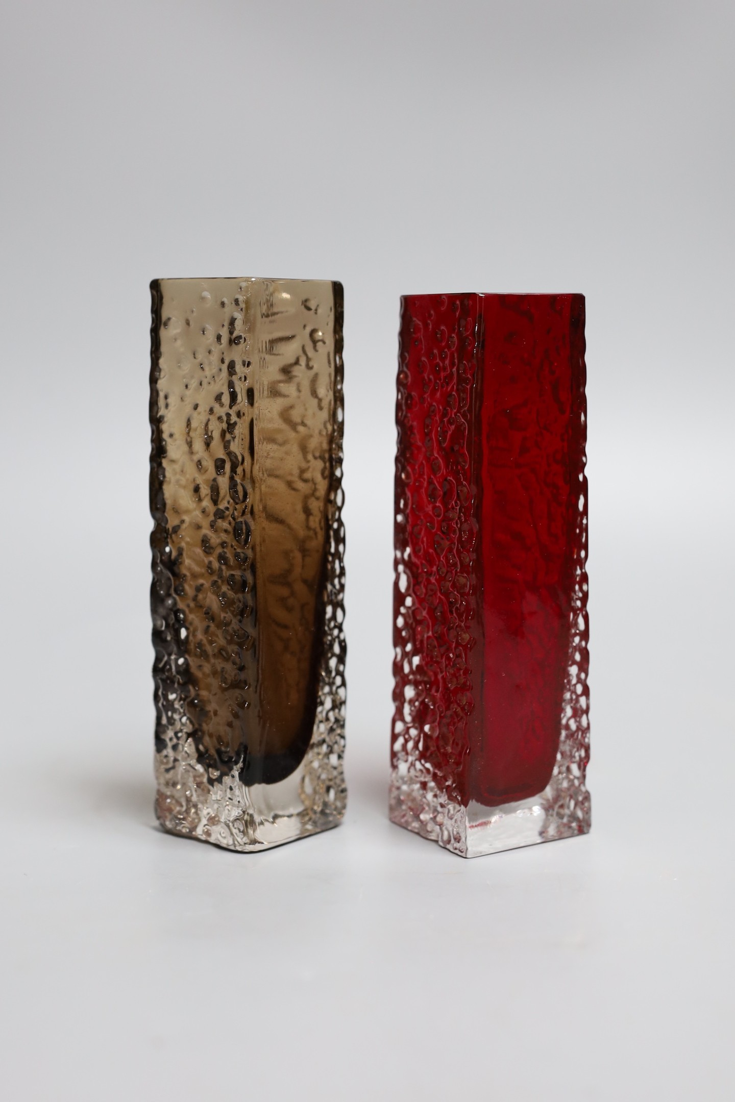 Two Whitefriars red 'Nailhead' vases, model 9683, designed by Geoffrey Baxter, each 17cm high.